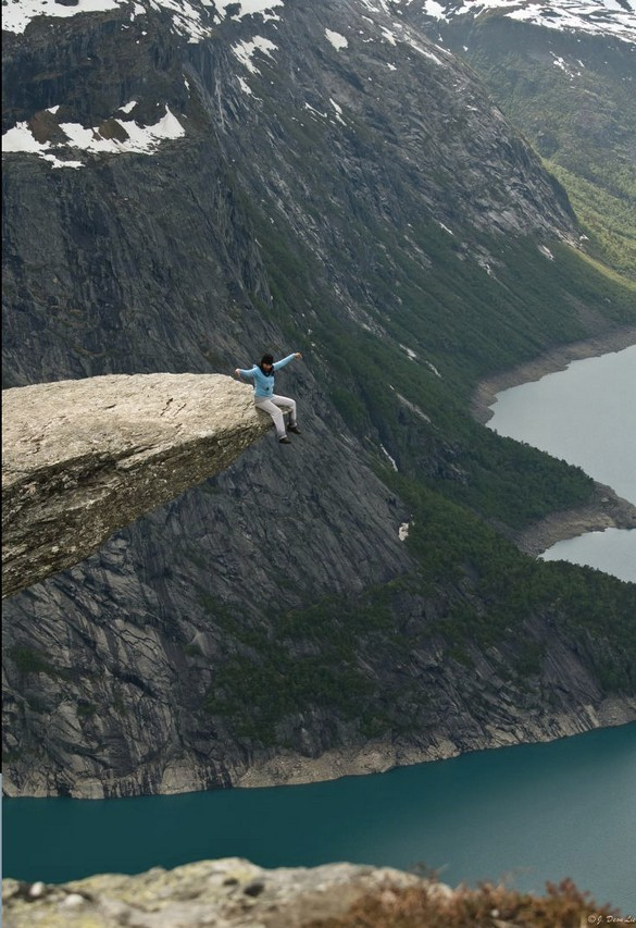 Sitting on the Trolltunga rock in Norway. 